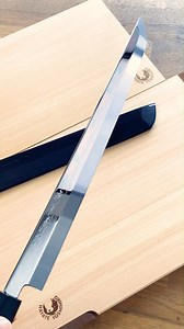 Honyaki, meaning "true forged," represents the pinnacle of Japanese knife making, crafted using centuries-old swordsmithing techniques. Forged from a single piece of White Steel #2 with an HRC of 65, each knife is heated to extreme temperatures, quenched in cool water, and polished to a mirror finish, achieving unmatched sharpness and durability. The Sakimaru Takobiki is a long, slender slicing knife designed for precision, ideal for creating delicate sashimi cuts and sushi rolls. Its sharp, rou