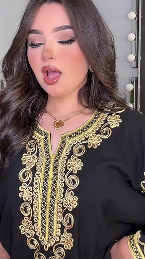 Elegant Black Garment with Gold Embroidery Showcase