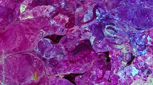 This stock video features a slow motion footage of oil paint motion, where Paint pigment are separated by light paint. Use this clip as background for creative concept videos, presentations, and more.