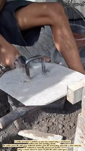 Molding concrete hollow blocks using a vibrating press machine.