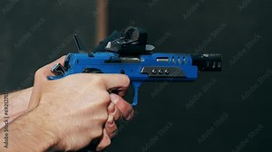 Automatic pistol shooting close-up. Participate in pistol qualification small arms marksmanship training. Semi-automatic 9mm pistol and bullets on wooden table indoors