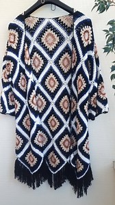 Enjoy turning heads this season in classically inspired long crochet cardigan with colorful floral granny square motifs! Can be styled as fall coat, crochet duster, kimono cardigan, etc. | Theposhcrochet | Facebook