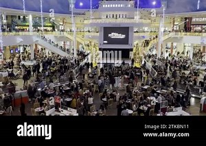 MANCHESTER, ENGLAND, UNITED KINGDOM - 12.26.2022: Panning shot of diverse people dining in the largest food court in Europe, Trafford Centre shopping mall Stock Video Footage - Alamy
