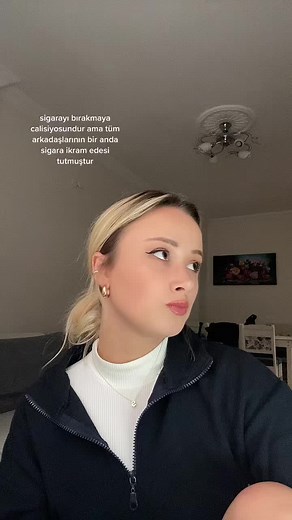 Blonde Individual with Blue Object in Indoor Setting