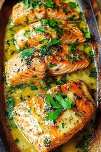 🔥 **Garlic Herb Butter Salmon** Tender, juicy salmon baked in a rich garlic-herb butter sauce — simple, elegant, and insanely flavorful! **Ingredients:** • 4 salmon fillets • 3 tbsp melted butter • 3 garlic cloves, minced • 1 tbsp lemon juice • 1 tbsp chopped parsley • 1 tsp dried oregano • 1 tsp dried basil • Salt & black pepper **Instructions:** 1. Preheat oven to **400°F (200°C)**. 2. Whisk melted butter, garlic, lemon juice, parsley, oregano, basil, salt, and pepper. 3. Place salmon in a ba