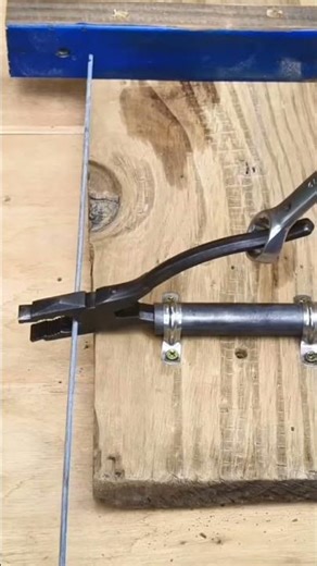 Make a metal holder for pliers and use a wrench as a lever. Simple setup, strong grip, and useful.