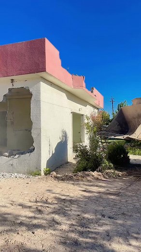 Demolition of a Building with Excavator in Action