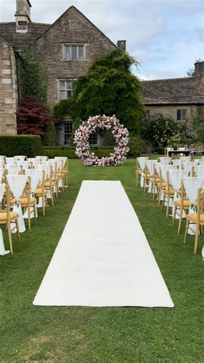 Everything Covered Venue Styling on Instagram: "A picturesque outdoor summer ceremony featuring our gorgeous nude floral moongate, ivory chair drapes and aisle runner. It was the ideal setting amidst the breathtaking gardens of @barlow_woodseats_hall and we later relocated the backdrop inside behind the top table, incorporating nude table runners and candle centrepieces to enhance the rustic barn ambiance… #venuestylist #outdoorceremony #weddingdecor #venuestyling #gettingmarried"