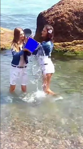 WOW! BEAUTIES PLAYFULLY POUR BUCKETS OVER EACH OTHER AND GET COMPLETELY WET AND THEY REALLY LIKE IT!