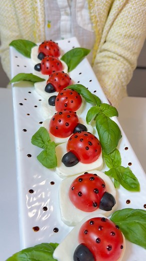 Ladybug Snacks! Tomatoes, Cheese, and a Whole Lot of Yum These adorable Caprese Ladybug Bites are made with cherry tomatoes, buffalo mozzarella, fresh basil, and a touch of balsamic glaze. Halved olives form their little heads while dots of glaze give them their signature spots. This fun, no-cook summer appetizer is perfect for parties, charcuterie boards, or garden-themed events. Easy, healthy, and irresistibly cute—these ladybug snacks are almost too pretty to eat… almost. #CapreseLadybugs #Su