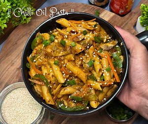 Chilli Oil Pasta | Spicy pasta recipe | Spicy Garlic Pasta | 10-minute pasta recipe #chillioilpasta #pasta #pastalovers #spicypasta #easypasta #chillioil #pastarecipe Turn up the heat with Chilli Oil Fusion Pasta! 🔥🍝 Bold, fiery, and full of flavor—this spicy blend of dry red chilies, garlic, noodle masala, soy-chili sauces, peanut butter, and spring onion coats every bite of pasta and veggies for an irresistible fusion feast! | Passion2cook