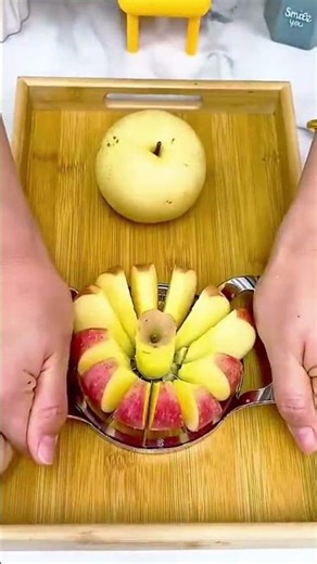 Apple slices neatly arranged in a circular pattern on a tray