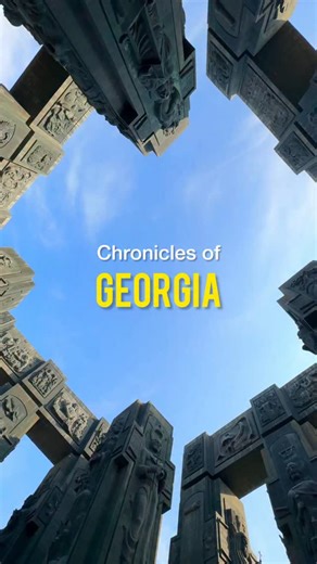 HisTravelInstincts on Instagram: "Chronicles of Georgia looks like a sci-fi monument but it’s actually telling 3,000 years of Georgian history in stone. Kings, queens and biblical scenes all stacked like a history lesson that forgot to be subtle. The lower panels show scenes from the Bible while the top celebrates Georgian rulers. Heaven below, history above. Gravity clearly works differently here. Where would you stand longer, looking up at the kings or down at the heavens? . . . #chroniclesofg