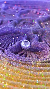 2M views · 10K reactions | Meet the mesmerizing masterpiece—a serene turtle brought to life by the Oasis Mini in dazzling gold and purple glitter sand. ✨ Watch as the ball glides effortlessly, carving intricate details into this enchanting work of art. It’s a meditative moment wrapped in pure magic. Ready to let your creativity shine? #kineticart #kineticsand #drawing #aesthetic #oasismini #relaxation #mesmerizing #art #zenvibes #glittersand | Grounded Labs | Facebook