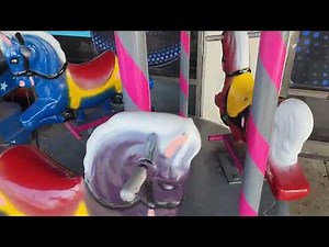 1970s Mini carousel kiddie ride (red, blue, dark purple, pink, black and gray)