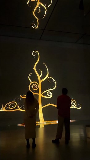 This National Tree Week, step into a story woven in gold. ✨ Did you know the swirling spirals in Gustav Klimt’s The Tree of Life are ancient symbols of growth, life cycles, and continuity. Klimt used them to show how life is always evolving. At FRAMELESS, watch the branches stretch toward the sky while the roots hold fast to the earth, a glowing reminder of life's endless flow. 🌳💛 Look closely and you might spot its secrets: a lone black bird, often seen as a quiet nod to death, resting in har
