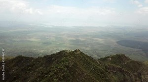 Aerial drone view revealing the surrounding lands of Longonot Mountain, Kenya.