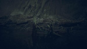 Mysterious ruins are found in a dark cave surrounded by rocky formations