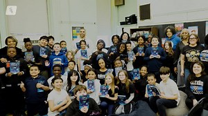 Micah Johnson reads his book at Minnie Miñoso Academy