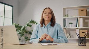A Successful Young Woman Conducts a Video Broadcast on Work Issues. A Woman Conducts Remote Work Training Courses. Technological Tools For Remote Work. Remote Work as a Way to Increase Productivity.