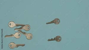 Finding the right key concept. Multiple keys explosion on blue background. Stop motion animation. 4K Stop motion animation.