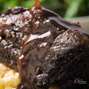 Fall-apart beef served with a rich and meaty red wine gravy. This is serious comfort food. The whole family devours my Crockpot Beef Short Ribs with Rich Gravy! Free Printable Recipe with hints and tips here: https://www.kitchensanctuary.com/crockpot-beef-short-ribs-with-rich-gravy/ | Kitchen Sanctuary