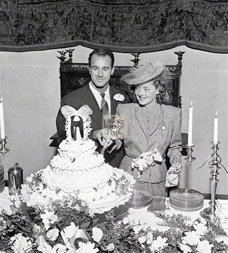 "Actress Bette Davis weds her third husband, painter William Grant Sherry, in an intimate ceremony at a Californian hotel in 1945. Known for her fierce independence and trailblazing career, Davis chose a quiet, elegant setting to mark this personal milestone. The wedding brought together close friends and a select few from Hollywood’s inner circle, offering a glimpse into the softer, more romantic side of the iconic star. Their union, celebrated with joy and understated glamour, reflected the er
