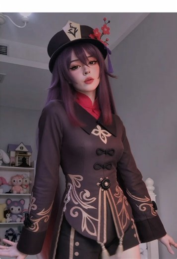 Hu Tao (Chinese: 胡桃; pinyin: Hú Táo; lit. ‘Walnut’) is a character from Genshin Impact, a 2020 action role-playing gacha game developed by miHoYo that somehow turned the entire world into a walking wallet. She is voiced by Tao Dian in Chinese (who clearly had the time of her life cackling through every line), Brianna Knickerbocker in English (bringing that perfect mix of bubbly menace and California sunshine), Rie Takahashi in Japanese (because nothing says “adorable gremlin” like perfect anime 