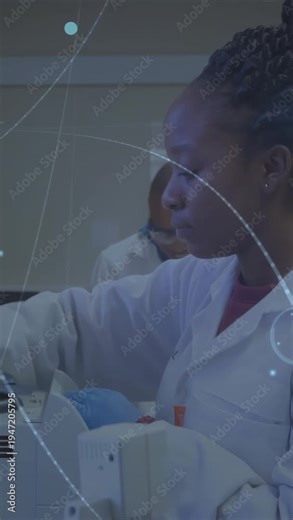 Vertical video: Woman lab tech lifting tube and loading analyzer for sample analysis, HUD sweeping