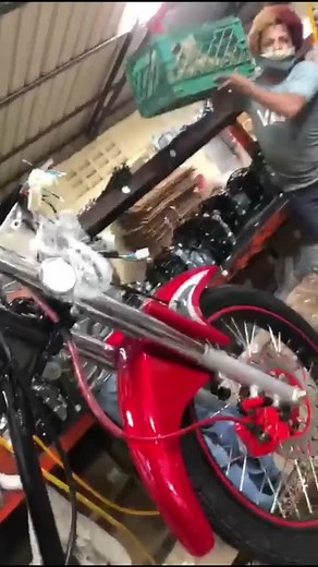 Motorcycle Repair in an Industrial Workshop Setting