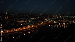 Arnhem city in the Netherlands by night Aerial drone. City center, rhine river and church, Eusebiuskerk, john frost bridge, skyline and infrastructure, city center.