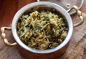 The Spinach Rice Recipe, is a simple, healthy preparation of cooked rice tossed in spinach spiced with sambar powder. I most often like to use sambar powder and cardamom powder as the main ingredients to make the spinach rice, but you can use a combination of spices and experiment to suit your taste. The Spinach Rice makes a great lunch box meal filled with nutrition of spinach and rice, when served along with Tomato Onion Raita, Tadka Raita or any other raita of your choice. Recipe link - http: