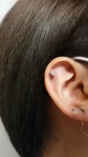 Earlobe Piercing With a Gun.#earlobepiercing #piercing #piercingcare #piercinglovers #septumpiercing | piercing.world