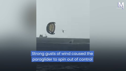 Tourist spins out of control after paragliding instructor plunges out of sky