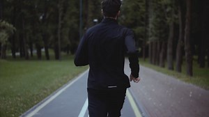 Man Running Fast On Park Road Real Time Shot Stock Footage SBV-325810696 - Storyblocks
