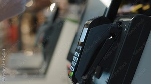 Details female hands paying with phone purchase by cell-phone electronic payment machine card reader e-money concept. Woman client pay smartphone. Pos-terminal buy cashless wifi qr code nfc scan app