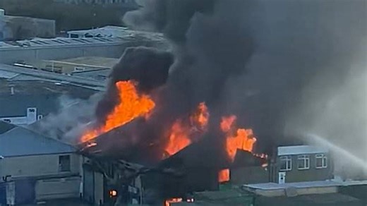 Thick black smoke billows from London warehouse as huge fire takes hold