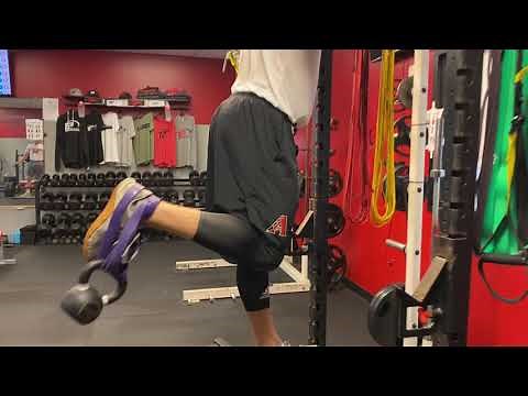 Standing Single Leg Hamstring Curls (Banded + Kettlebell)