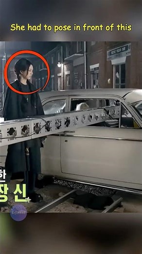 She had to pose in front of this