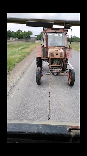 Exploring the Versatile Red Tractor in Action