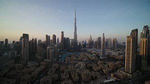 Aerial view of modern Dubai cityscape at sunset, United Arab Emirates.