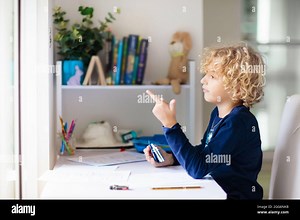 Online remote learning. School kids with computer having video conference chat with teacher and class group. Child studying from home Stock Photo - Alamy
