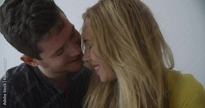 happy couple first kiss. girl kissing boyfriend at home after romantic evening date together 4k