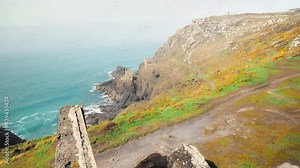 Crowns Engine Houses - ruins of an old ancient English abandoned building in 4k. A beautiful scenic coastline heritage in Cornwall, England, UK.