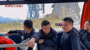 Take a journey on a cable car and enjoy the awe-inspiring views as you ascend over the mountain's summit and take in the breathtaking panorama of Tianmen Mountain beneath you. | People's Daily, China