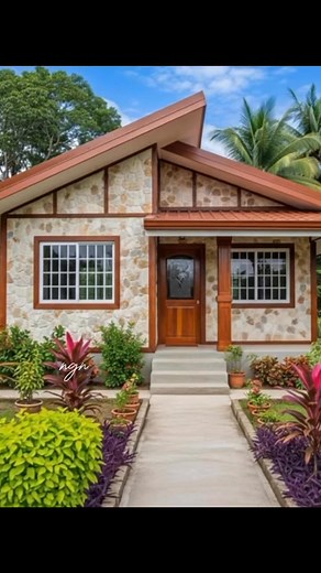 2.4K reactions · 188 shares | A charming bungalow with natural stone walls, wooden accents, and a modern sloped roof, surrounded by lush tropical plants and a neat garden walkway that highlights its warm and inviting design. #reels #Amazing #Philippines #nature #house | Nathaniel Guevarra Navarro | Facebook
