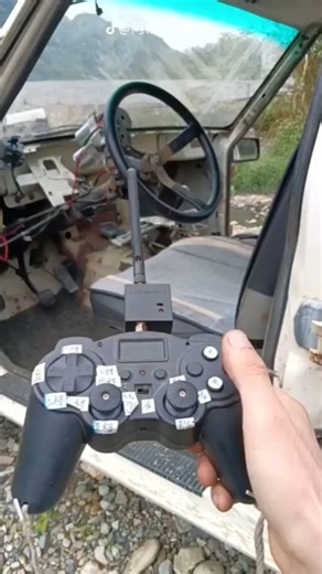 He controls the car via a remote control from an RC car #shorts