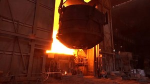 steel production in the metallurgical furnace. Loading of ore in the open-hearth furnace at a metallurgical plant