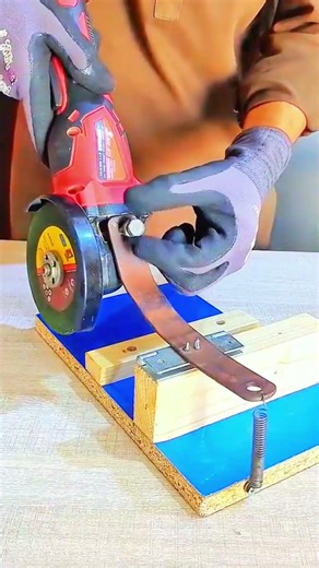 Angle grinder sparks fly—DIY jig guides precise metal cut.