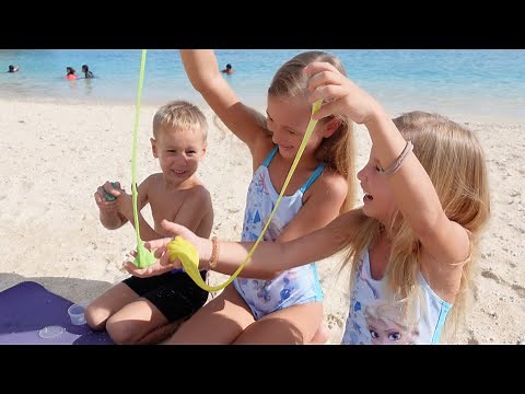 Children playing on the beach 4K